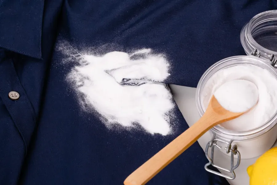 baking-soda-soaking-on-navy-blue-shirt